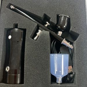 Opened but never used portable airbrush kit.